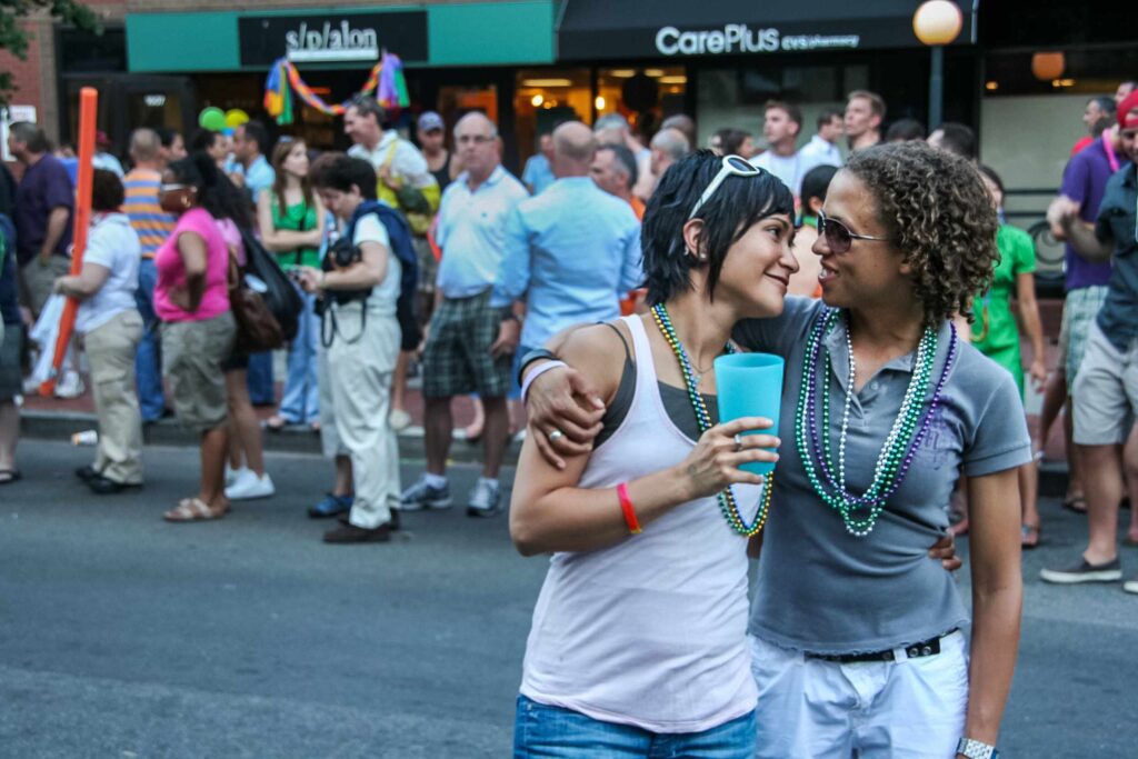 A same-sex couple look smilingly and lovingly into each others eyes during the Capitol Pride Parade